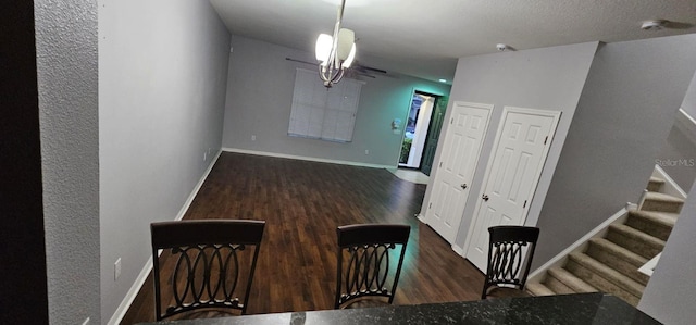 interior space with a chandelier and hardwood / wood-style flooring