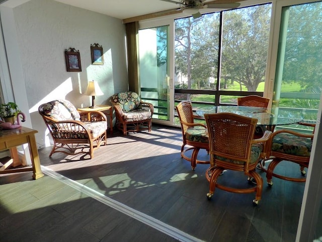 sunroom with a wealth of natural light and ceiling fan