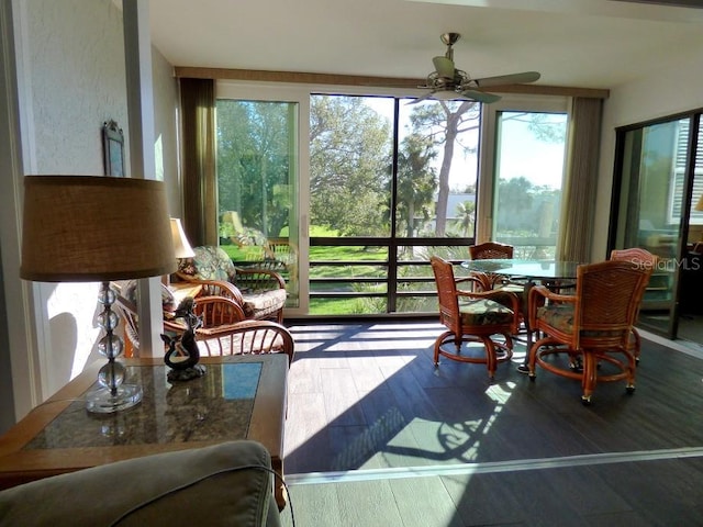 sunroom featuring ceiling fan