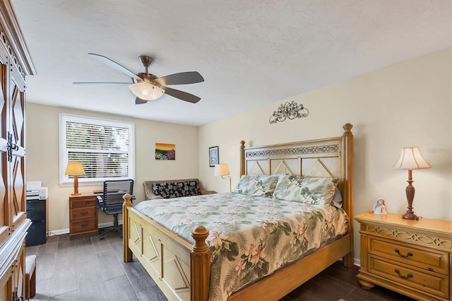 bedroom with ceiling fan and dark hardwood / wood-style floors