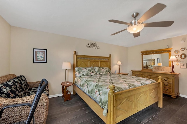 bedroom featuring ceiling fan and dark hardwood / wood-style floors