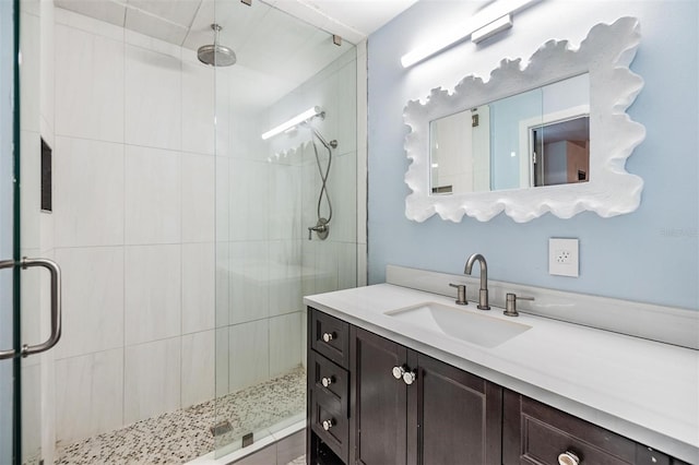 bathroom featuring vanity and walk in shower