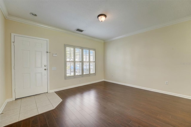 tiled entryway with ornamental molding