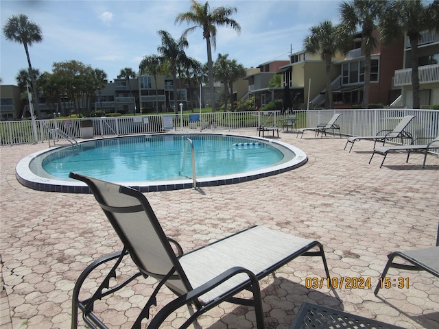 view of swimming pool featuring a patio