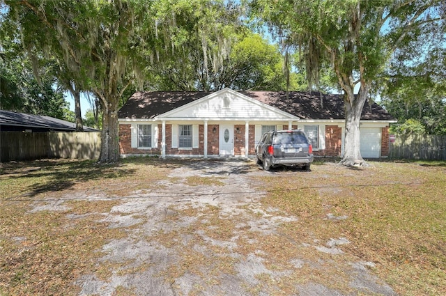 ranch-style home featuring a garage