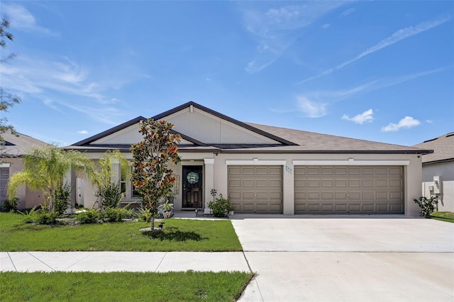 ranch-style home with a front lawn and a garage