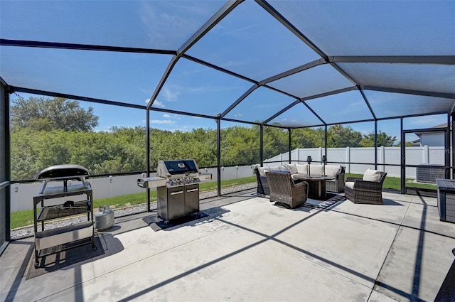 view of patio featuring grilling area, an outdoor living space, and glass enclosure