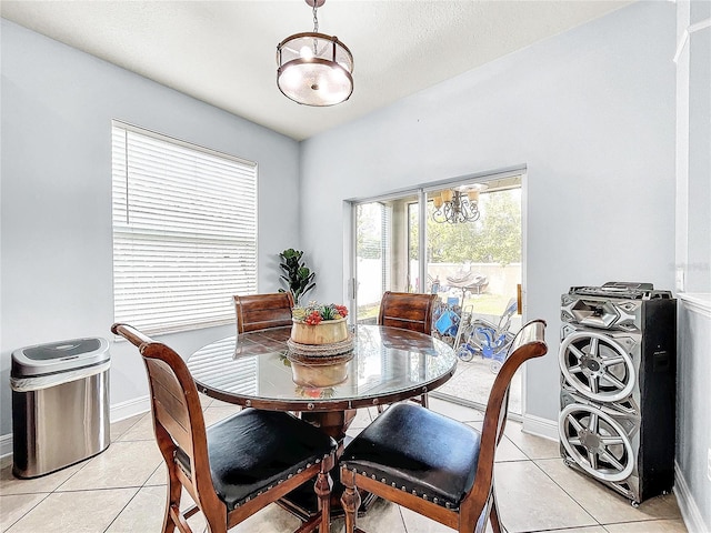 dining area featuring light tile flooring