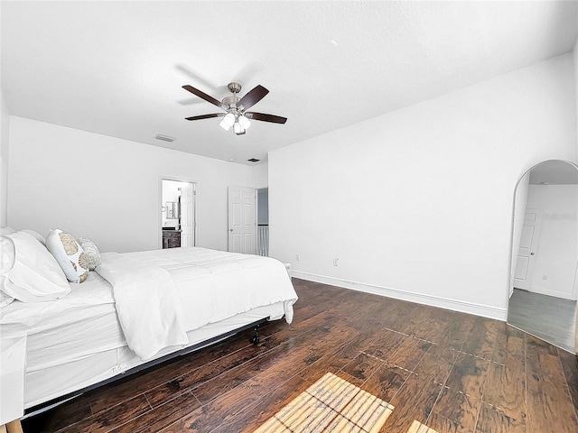 bedroom with ceiling fan and dark wood-type flooring