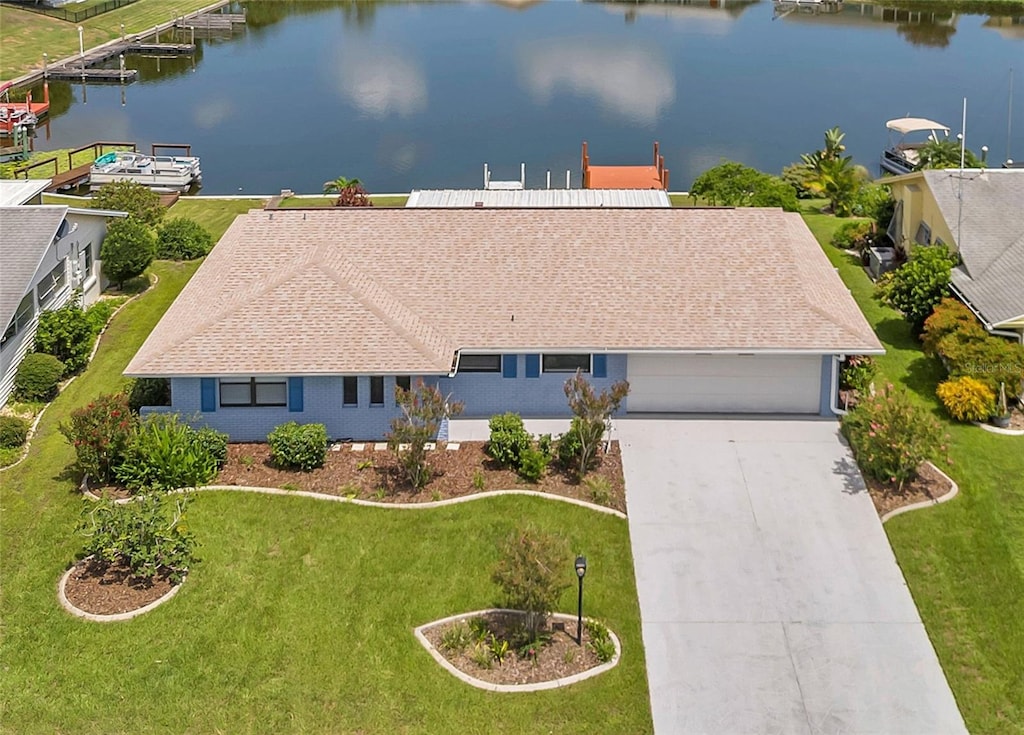 birds eye view of property featuring a water view