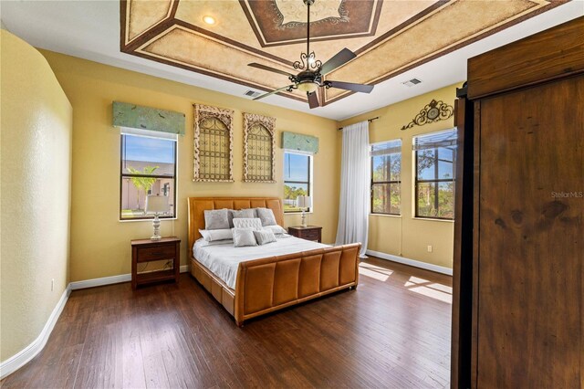 bedroom with ceiling fan and dark hardwood / wood-style floors