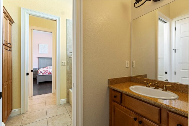 bathroom featuring tile flooring and vanity