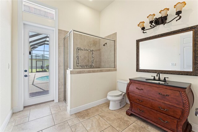 bathroom with tile floors, toilet, walk in shower, and oversized vanity