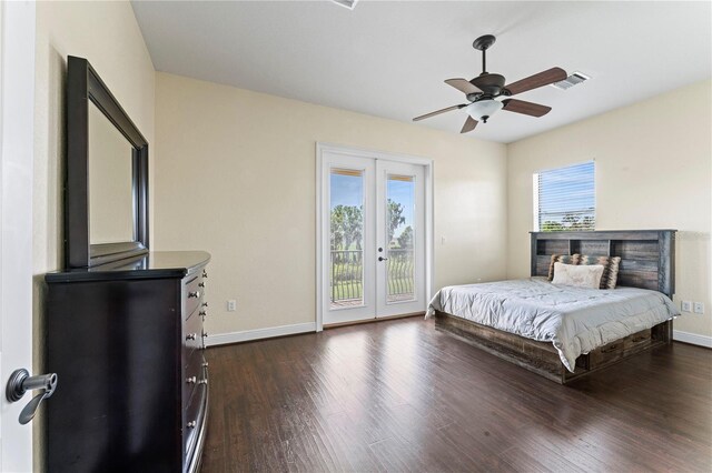 bedroom with ceiling fan, access to outside, multiple windows, and dark hardwood / wood-style flooring