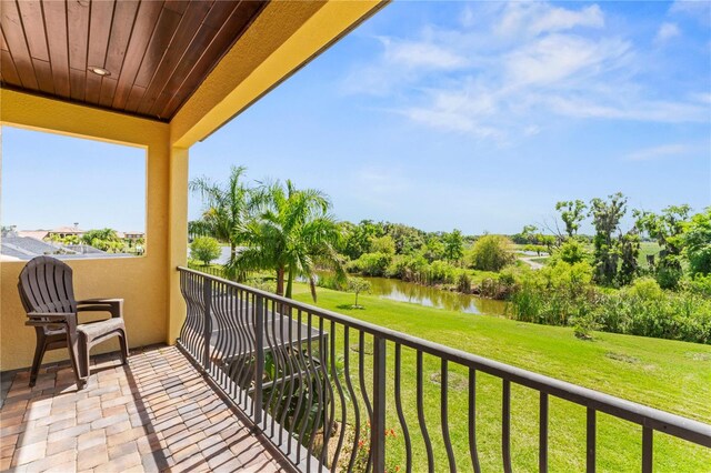 balcony featuring a water view