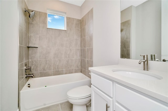 full bathroom featuring tile patterned floors, vanity, toilet, and tiled shower / bath