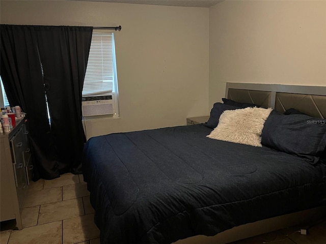 bedroom featuring light tile flooring