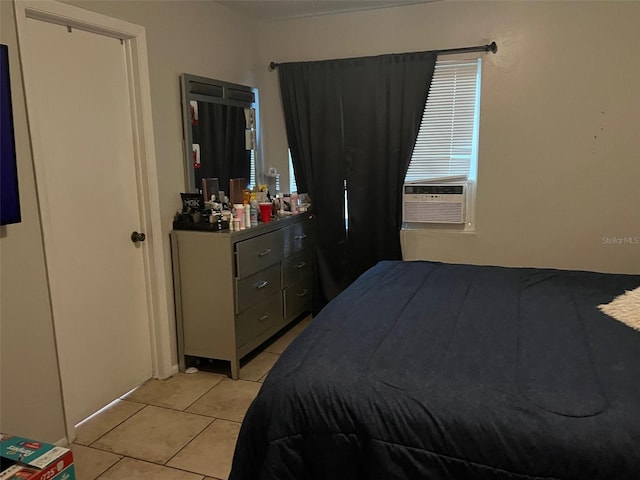 bedroom with light tile flooring