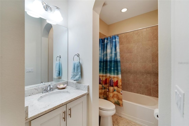 full bathroom with toilet, tile floors, shower / tub combo with curtain, and vanity with extensive cabinet space