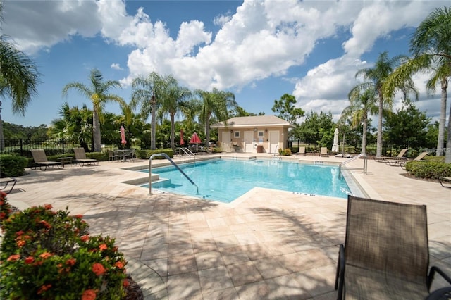 view of swimming pool featuring a patio area