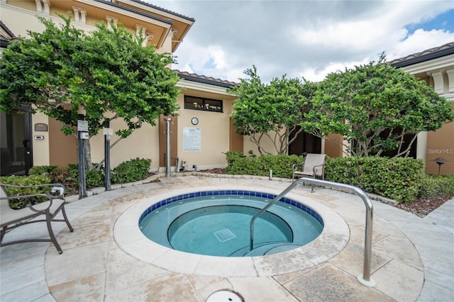 view of pool featuring a community hot tub