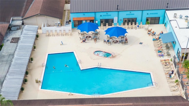 view of swimming pool with a patio area