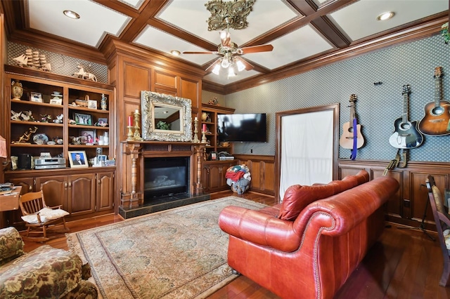 living room featuring crown molding, ceiling fan, coffered ceiling, and dark wood-type flooring