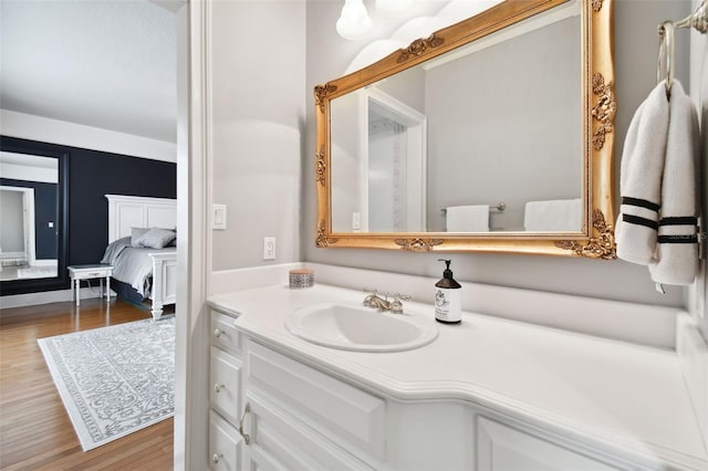 bathroom with vanity and wood-type flooring