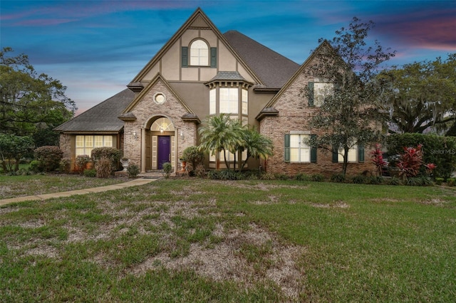 view of front of house with a yard