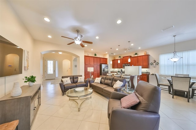 tiled living room featuring ceiling fan