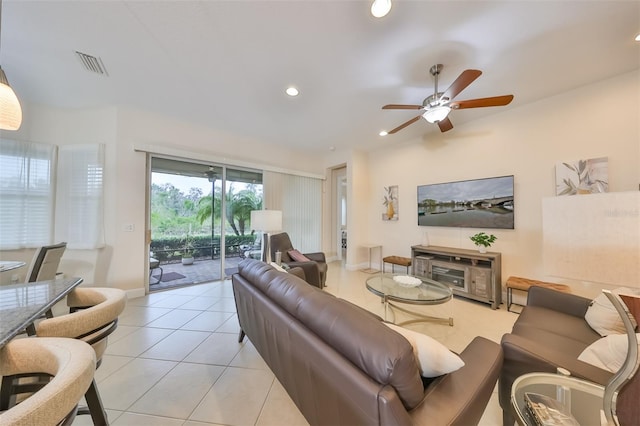 living room featuring ceiling fan and light tile patterned flooring