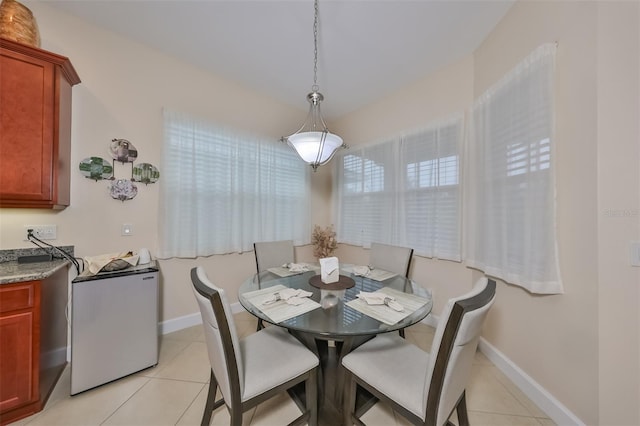 dining area with light tile patterned floors