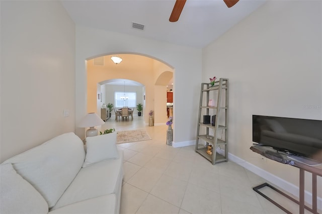 living room featuring ceiling fan and light tile patterned floors