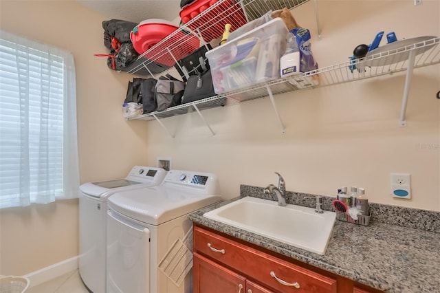 laundry area featuring sink, tile patterned flooring, and washer and dryer