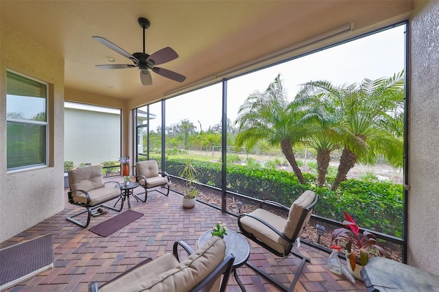 sunroom / solarium with ceiling fan