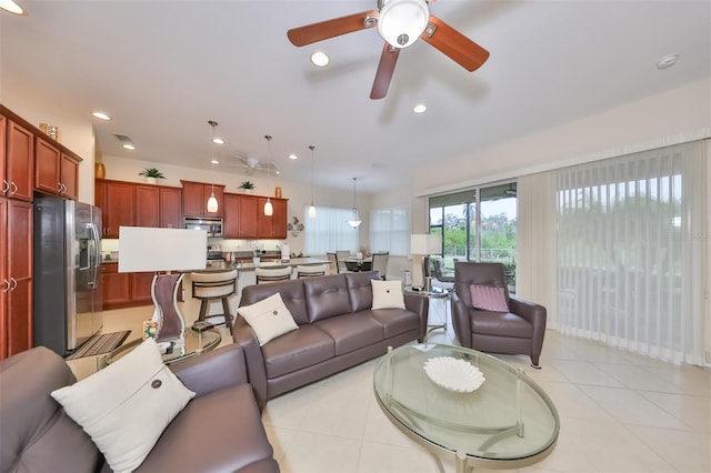 tiled living room featuring ceiling fan