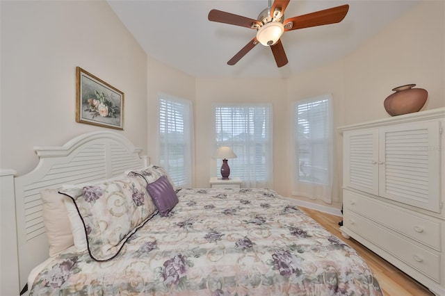 bedroom with ceiling fan and light wood-type flooring