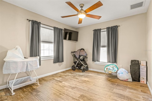 miscellaneous room featuring ceiling fan and light wood-type flooring