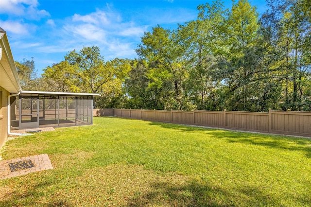 view of yard featuring a sunroom