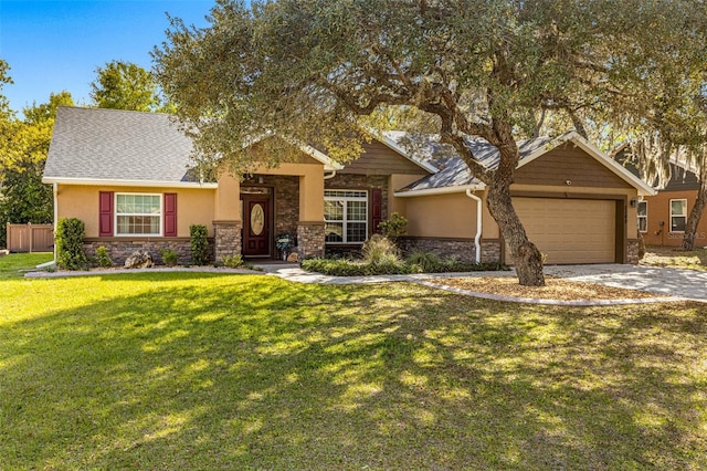 view of front facade featuring a front yard and a garage