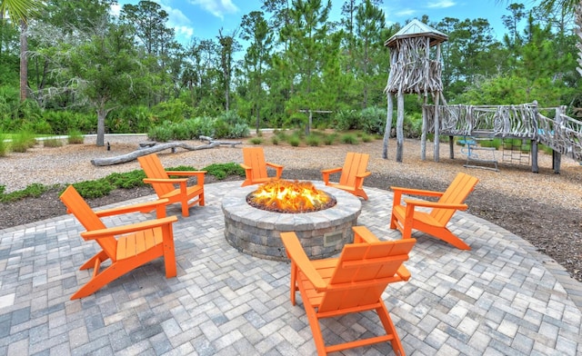 view of patio with a fire pit