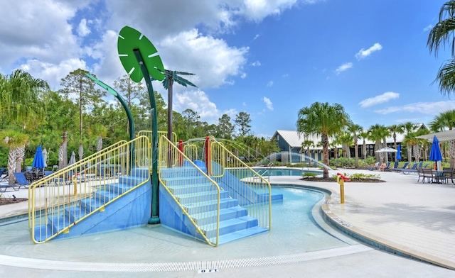 view of swimming pool featuring a patio area