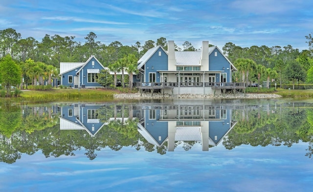 rear view of house with a water view