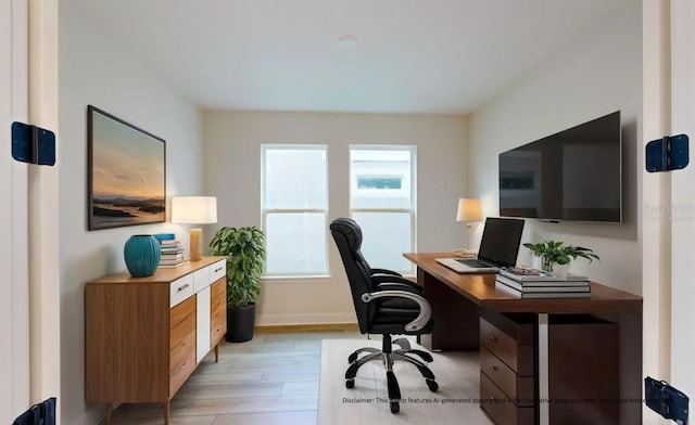 office space featuring a wealth of natural light and light hardwood / wood-style flooring