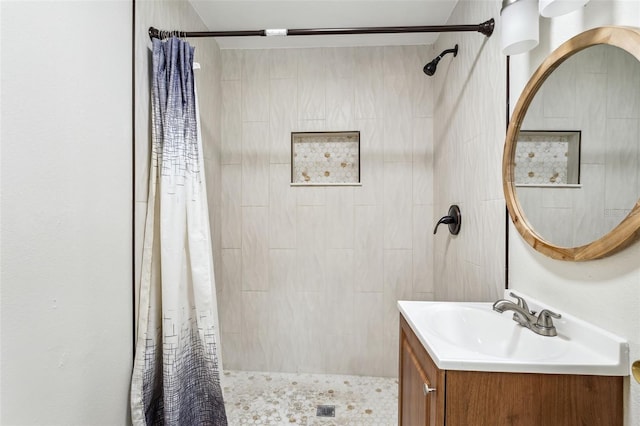 bathroom featuring a shower with curtain and vanity