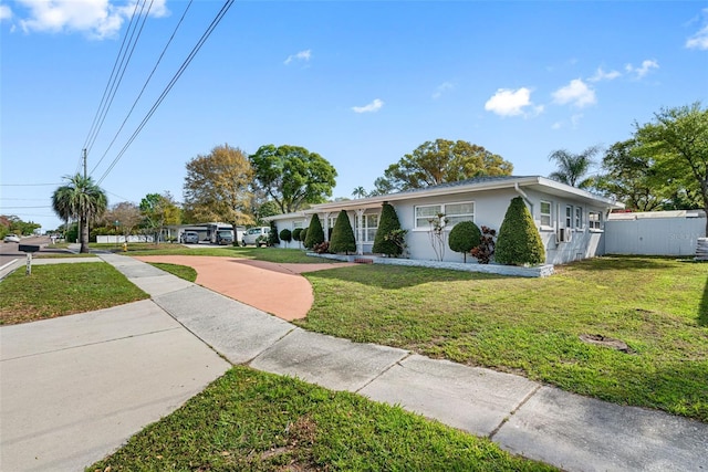 ranch-style house featuring a front lawn