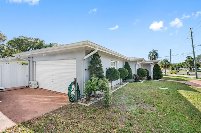 view of front of property with a garage and a front yard