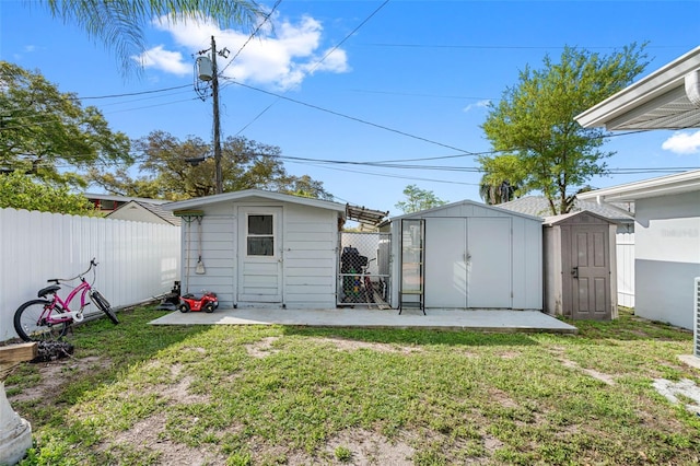 view of outbuilding with a yard