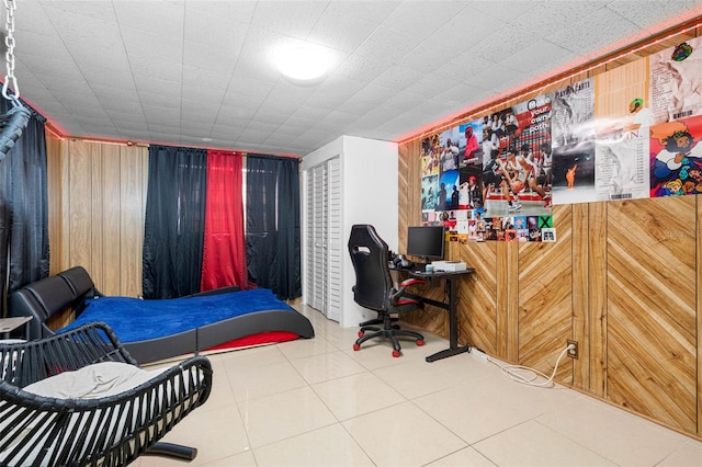 tiled bedroom with wood walls