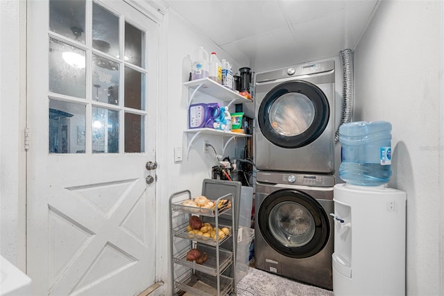 laundry area with stacked washing maching and dryer